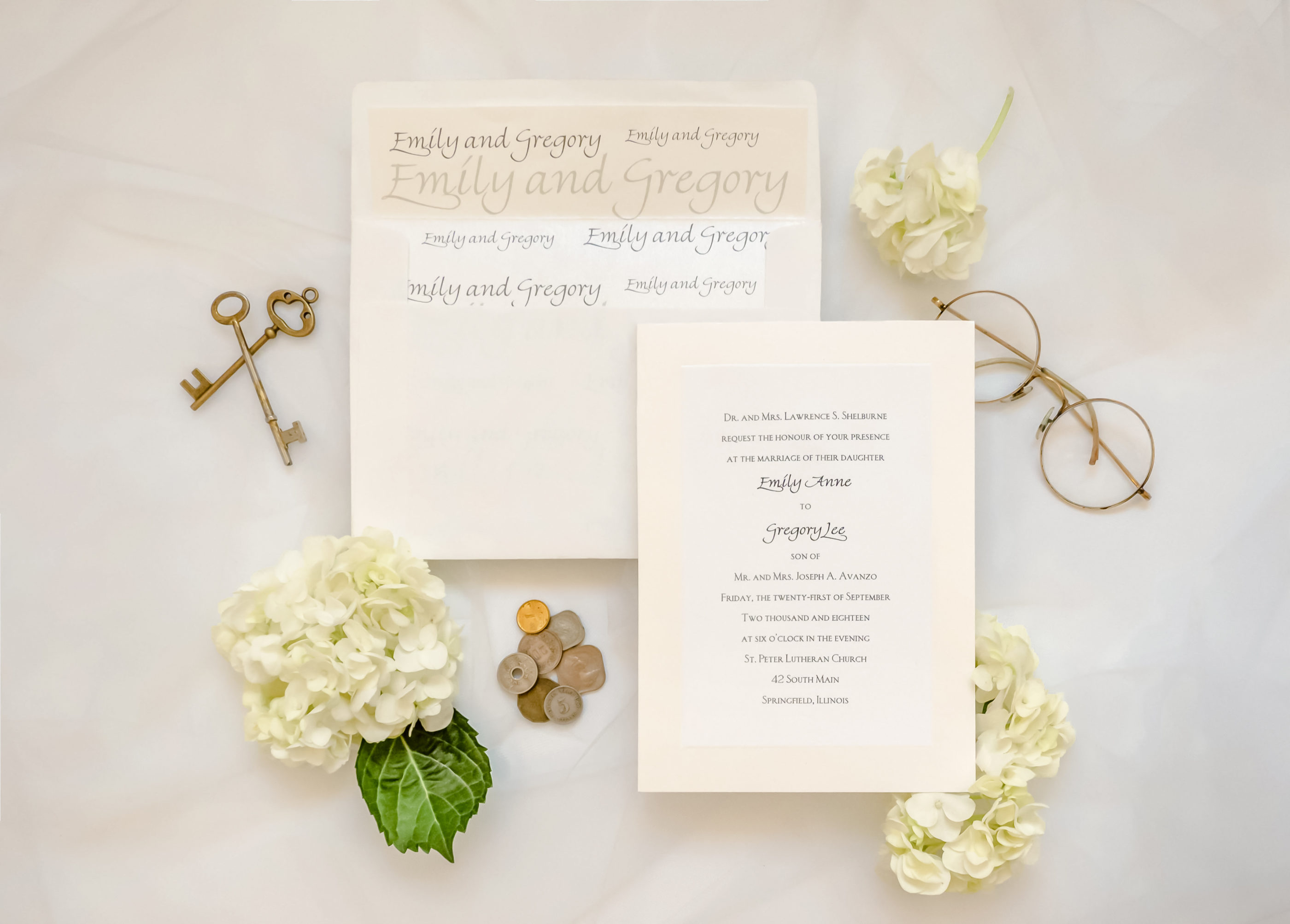 cream colored invitation and envelope with bride and groom's names on inside of envelope
