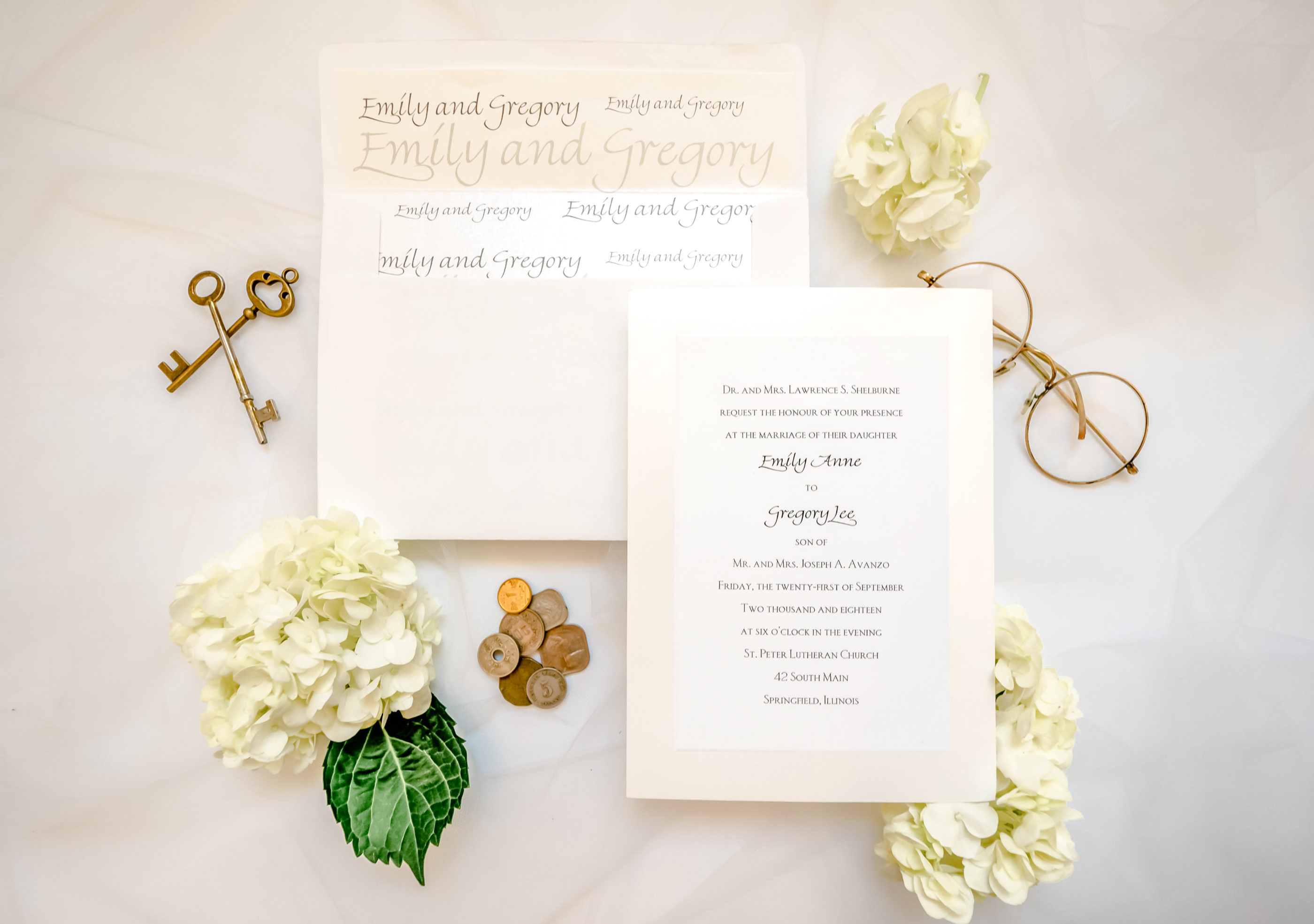 cream colored invitation and envelope with bride and groom's names on inside of envelope