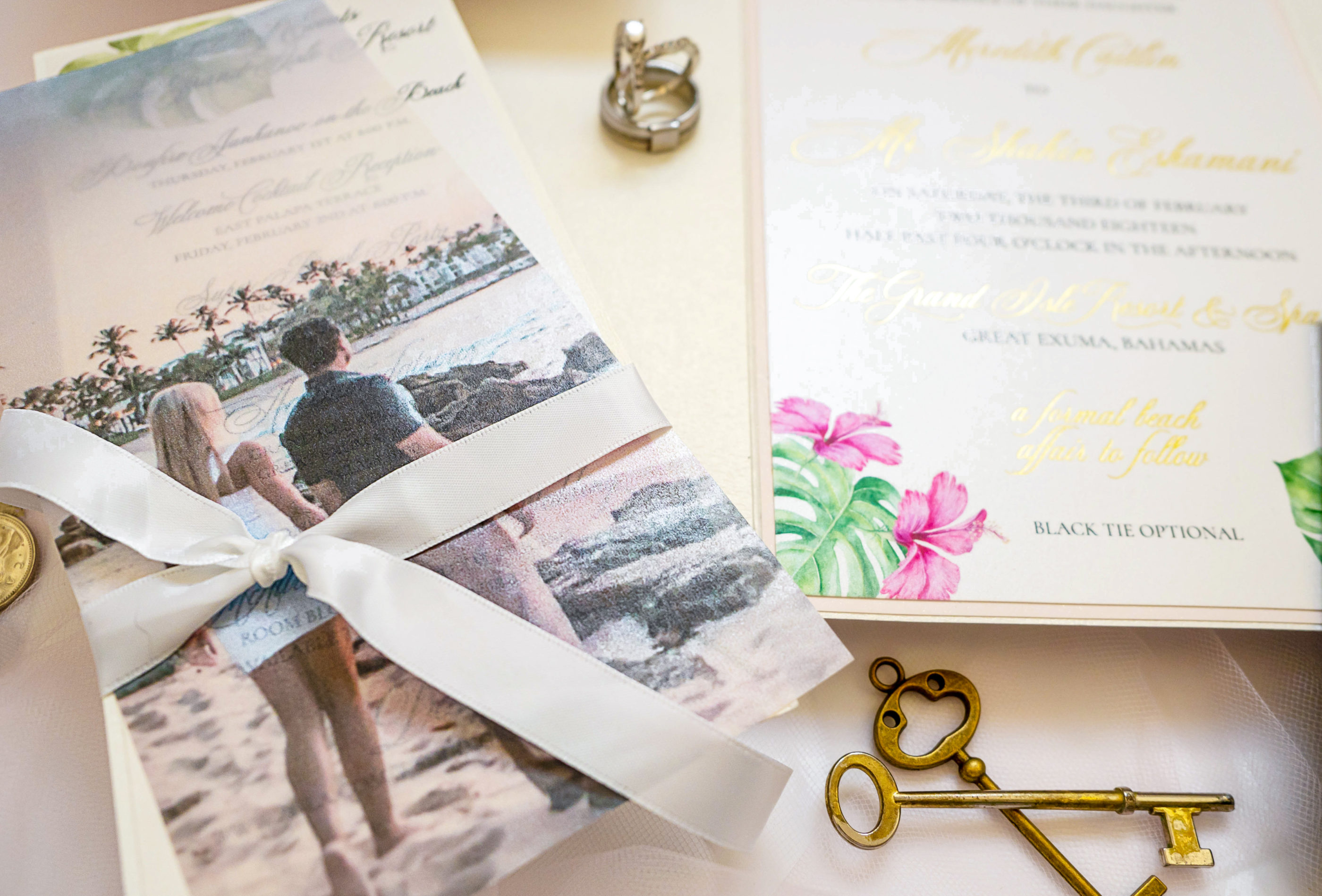 detailed photograph of the velum picture and satin ribbon in the grand bahamas destination wedding invitation suite
