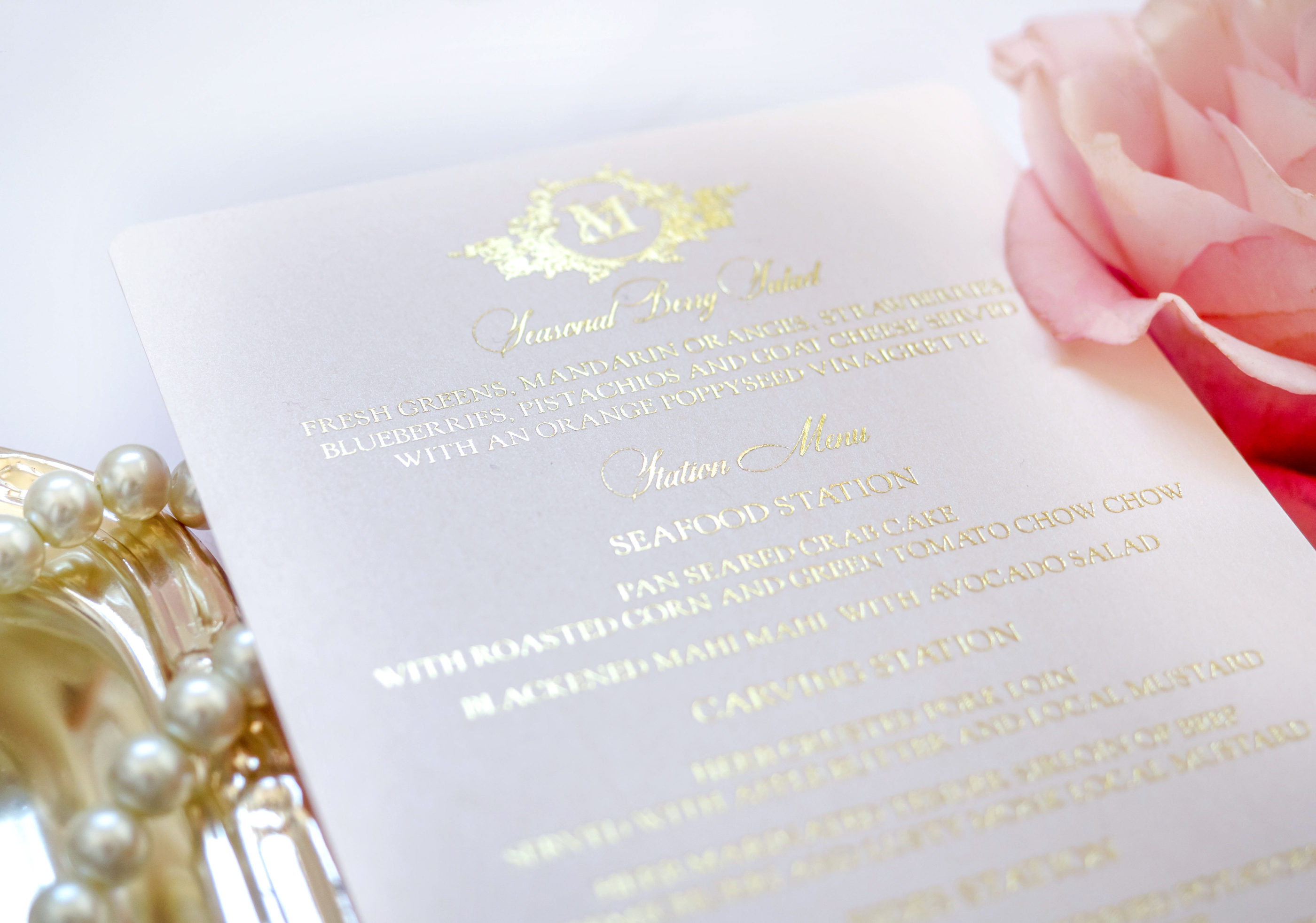 invitation photographed up close showing gold foil embossing