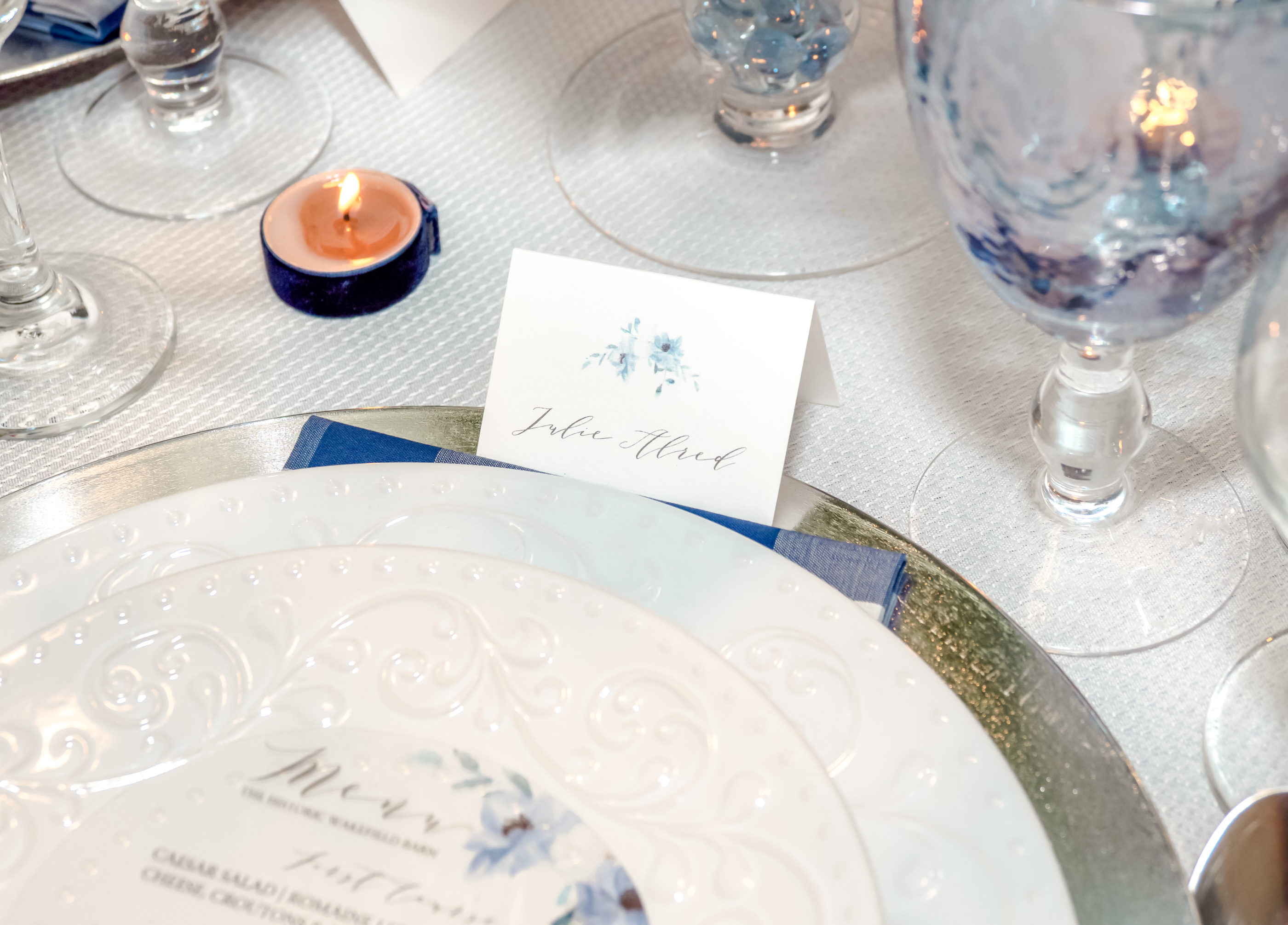 name card on reception table with guest's name at place setting