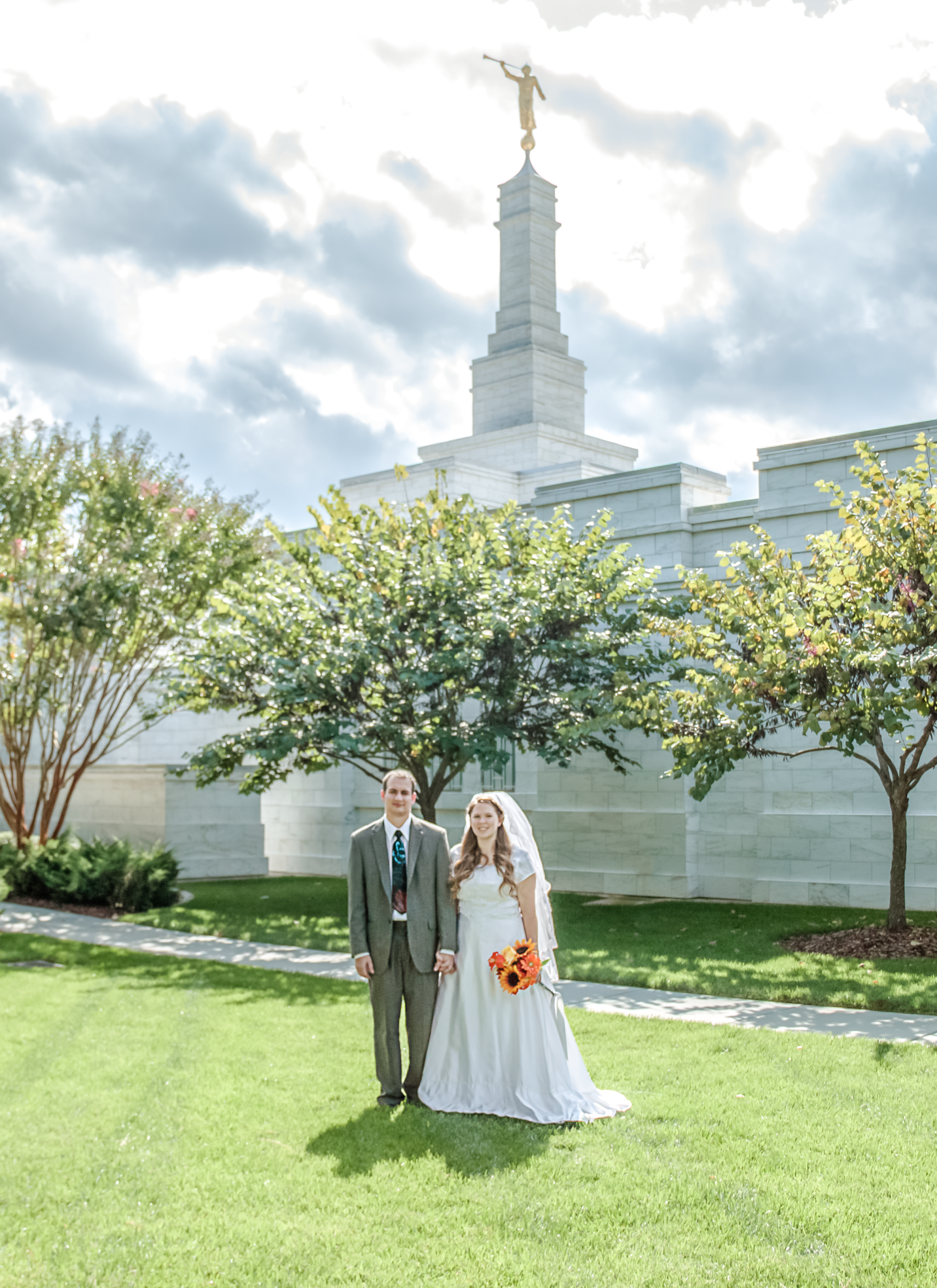 wedding couple standing in front of the raleigh nc mormon temple